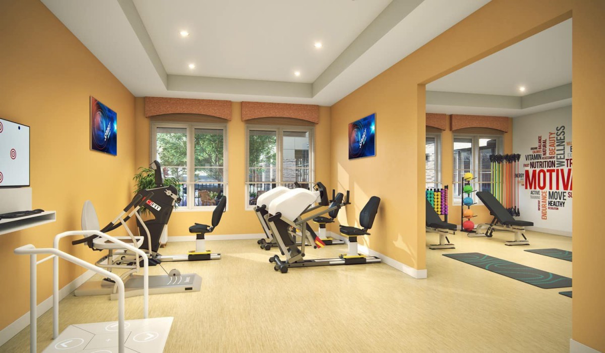 A well-equipped gym with modern exercise machines and a spacious layout.