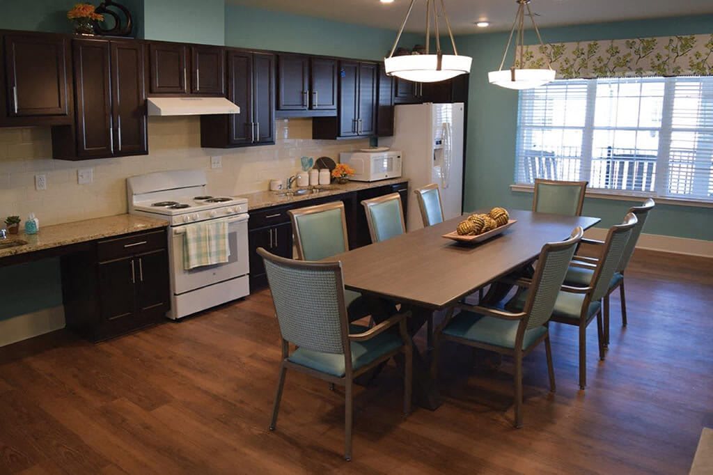 A modern kitchen and dining area with ample seating and contemporary appliances.