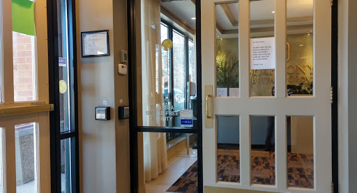 View of a welcoming reception area through a glass door.