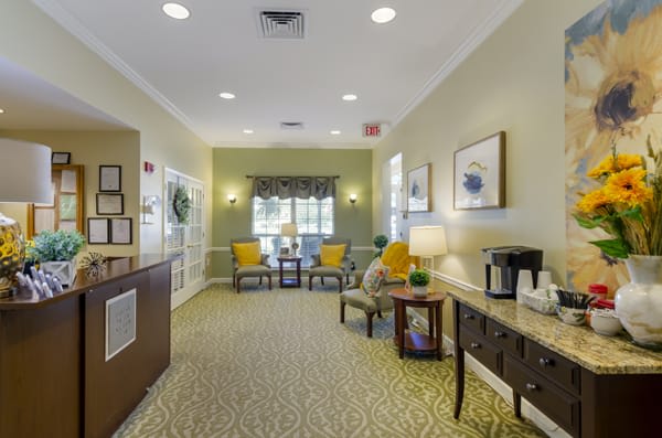 A well-lit lobby area with comfortable seating and decorative elements.