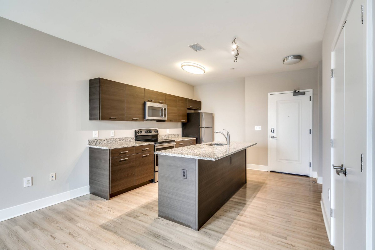 A modern kitchen with sleek appliances and a minimalist design.