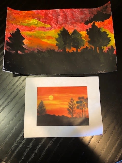 A vibrant sunset painting depicting silhouetted trees against an orange and red sky.