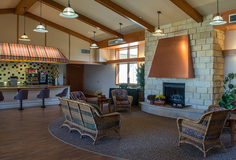 A cozy lobby featuring a fireplace and comfortable seating area.