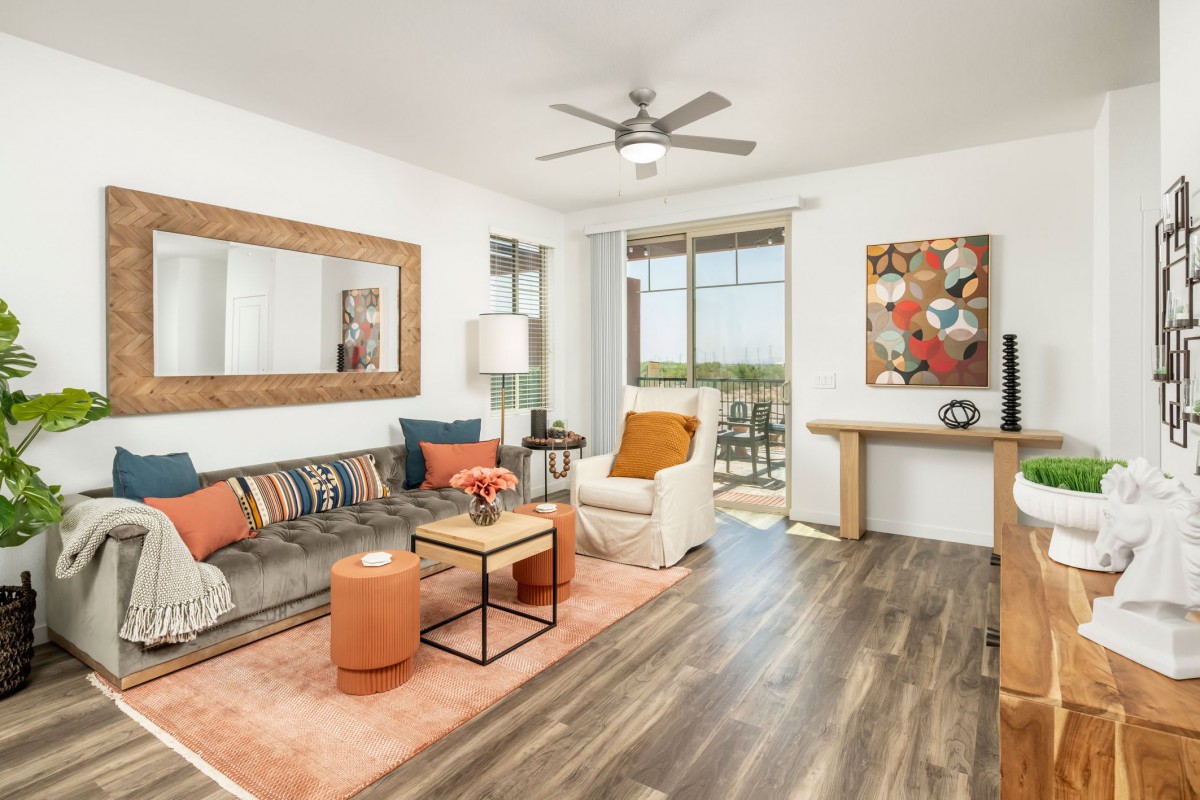 A modern living room with stylish decor and hardwood flooring.