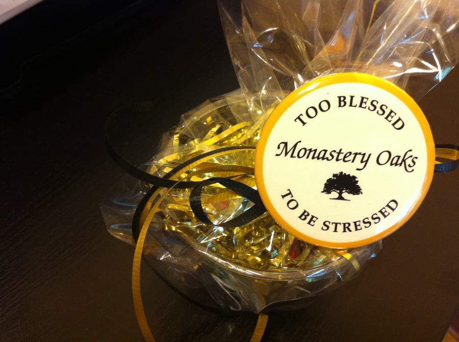 A beautifully wrapped gift with a label stating 'Too Blessed to be Stressed'.