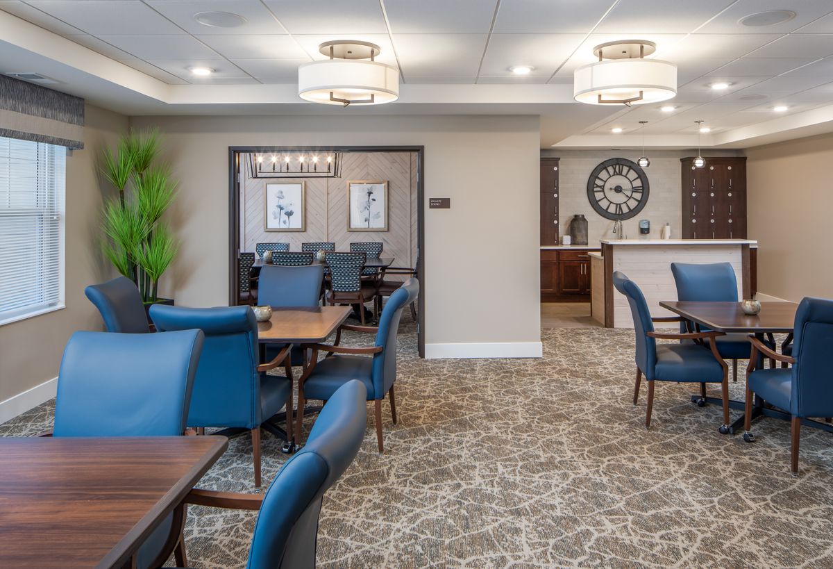 A modern lounge with comfortable seating and stylish lighting fixtures.
