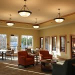 A cozy living area with comfortable chairs and ample natural lighting.