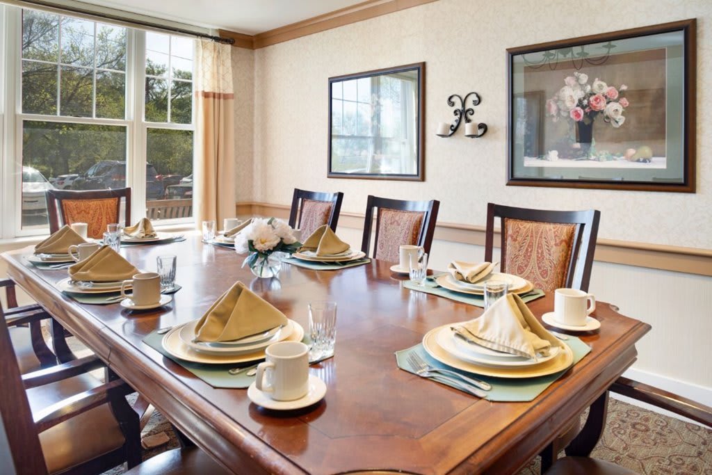 A beautifully set dining table in an elegant dining room.