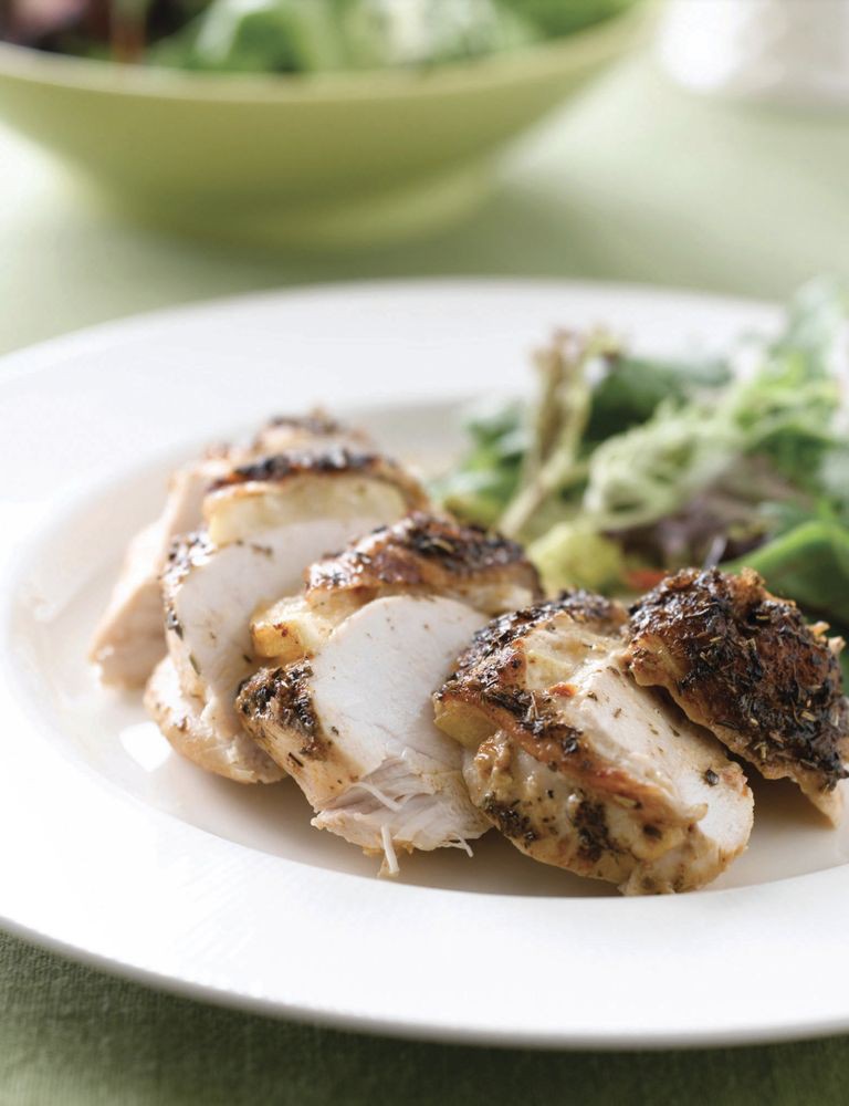 Stuffed chicken breast served with a fresh garden salad.