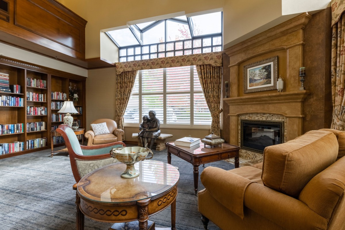 A luxurious living room with elegant furniture and a fireplace.