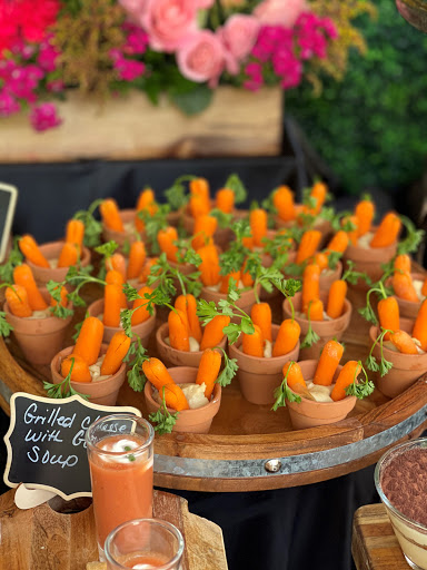 A delightful arrangement of carrot sticks presented in small cups, perfect for a fresh and crunchy snack.