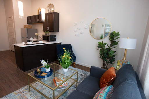 A stylish and modern living area featuring a cozy sofa, a chic coffee table, and elegant decorative elements.
