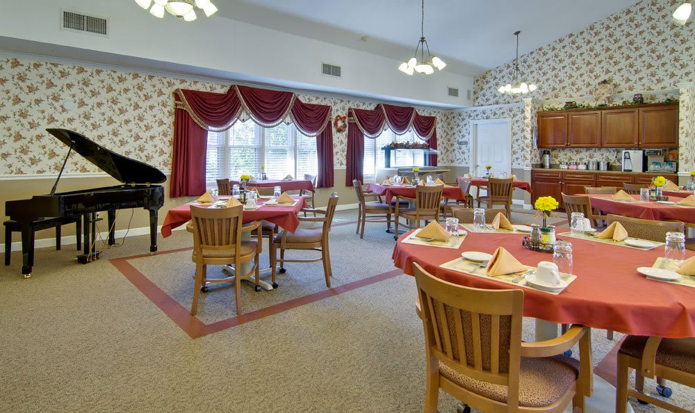 A cozy dining room with neatly arranged tables and elegant decor.