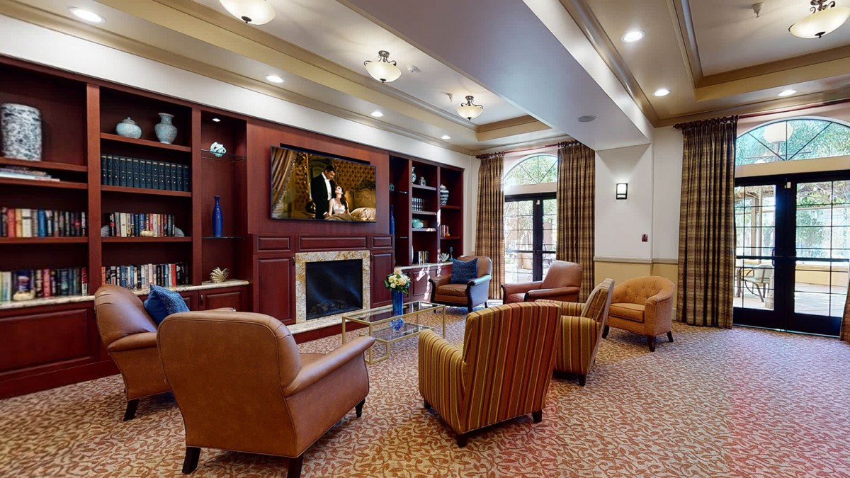 A cozy living room with comfortable seating and a fireplace.