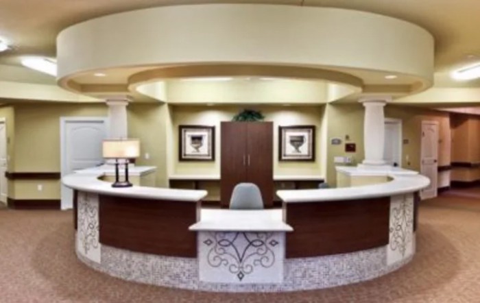 A modern reception desk with elegant interior design in an office lobby.