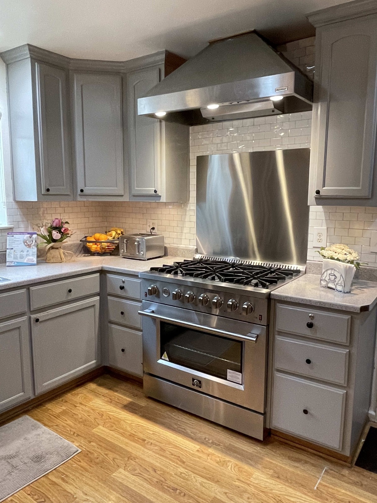 Modern kitchen with stainless steel appliances and sleek cabinetry.