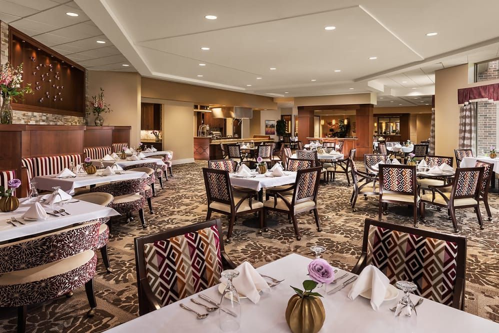 An elegant restaurant dining area with neatly set tables and stylish decor.
