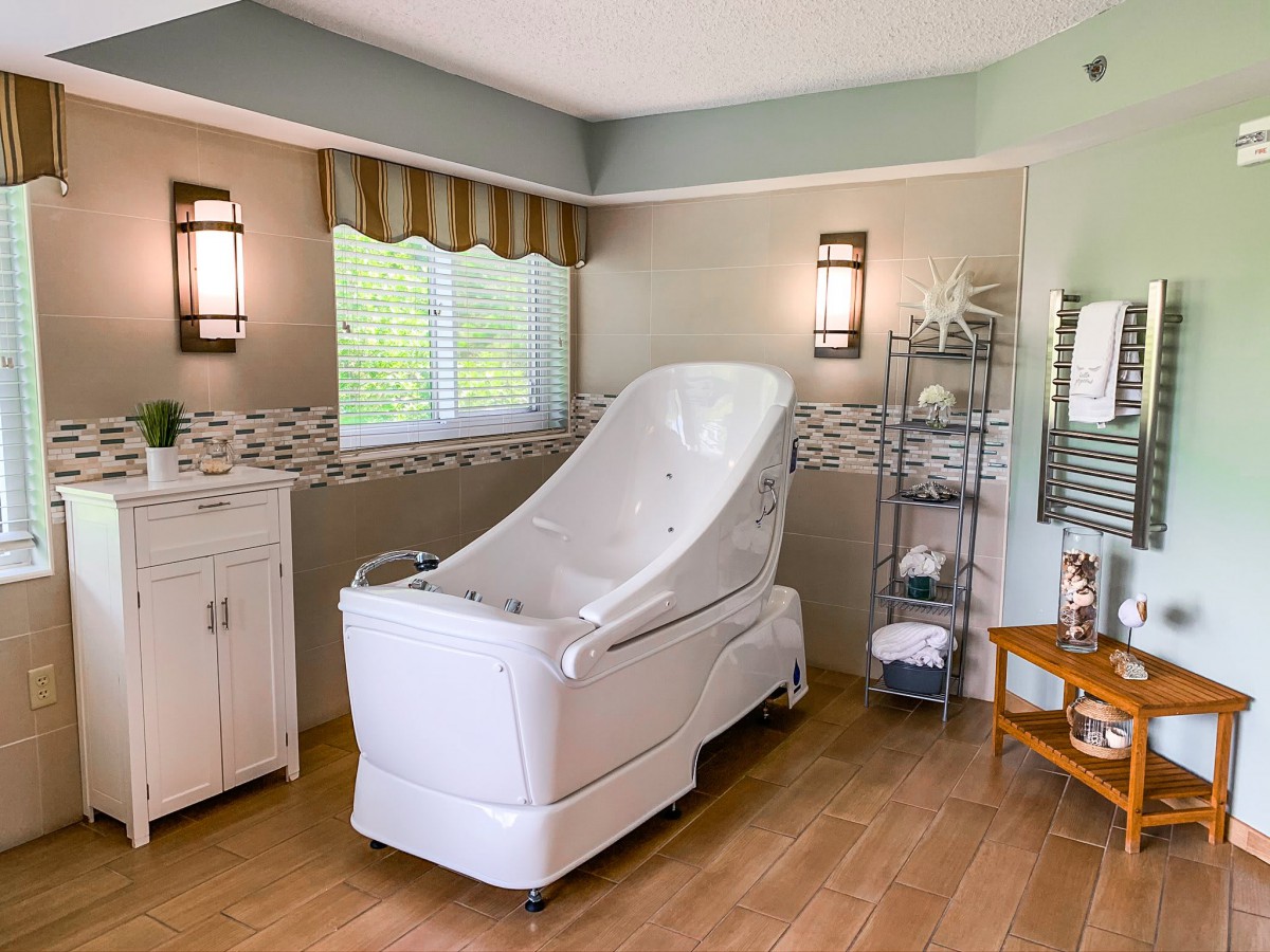 A luxurious spa room featuring a modern bath and elegant decor.