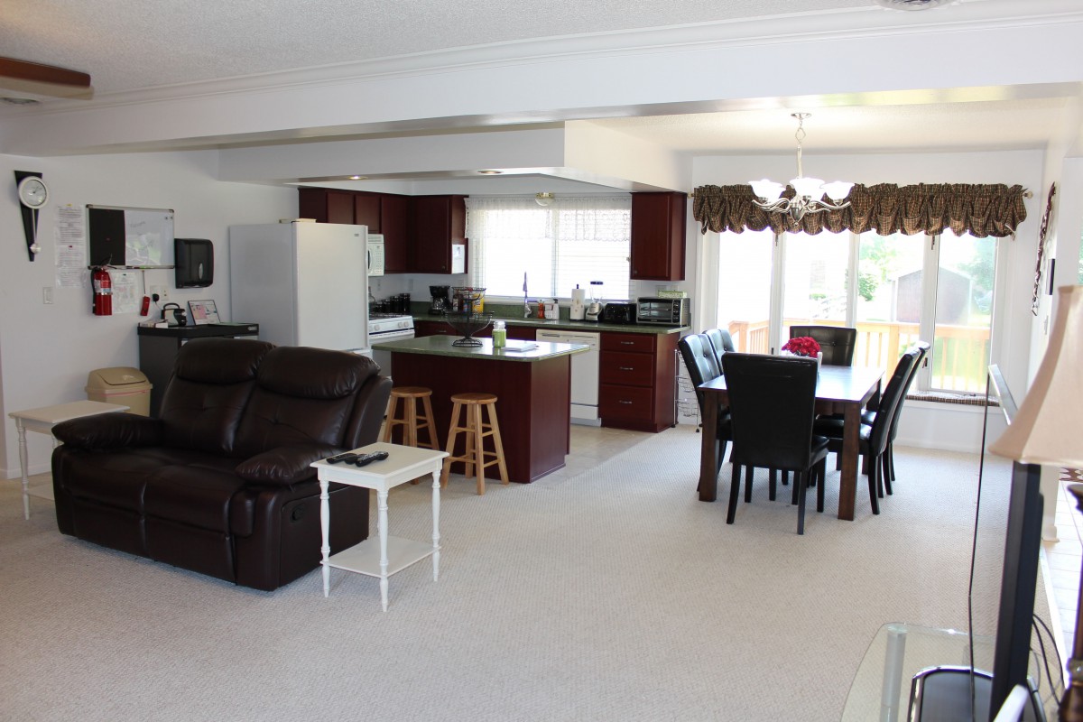 An open-concept living space with a kitchen and dining area.