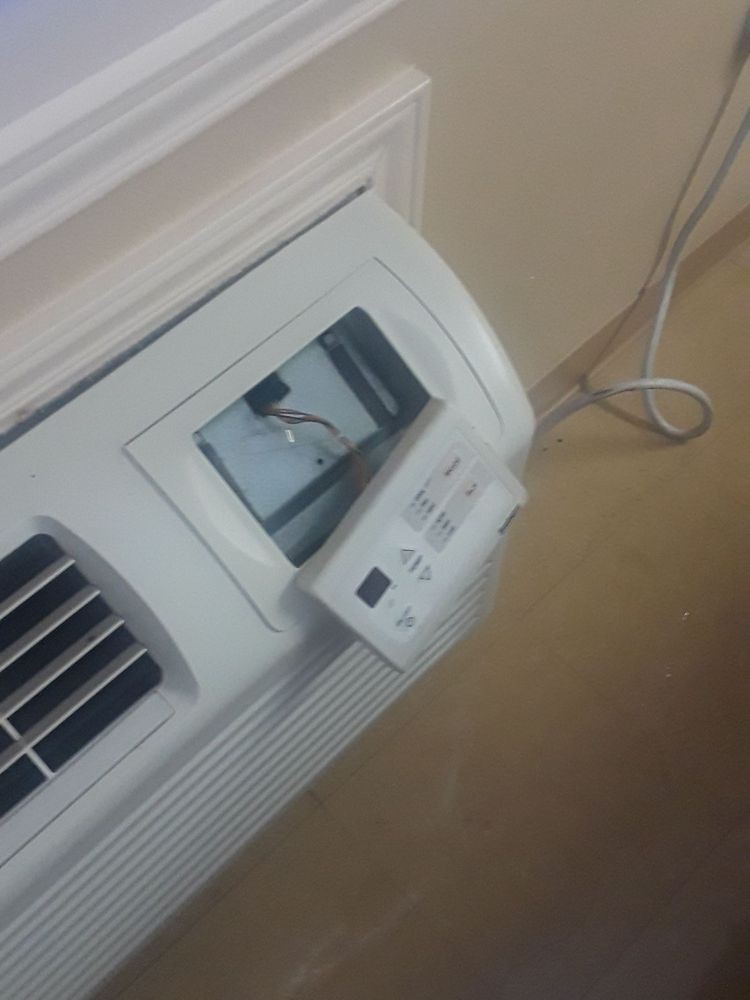 A close-up view of an air conditioner's control panel displaying settings.
