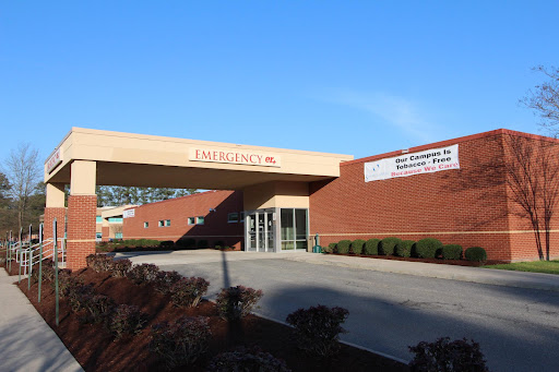 An exterior view of a healthcare facility on a clear day.