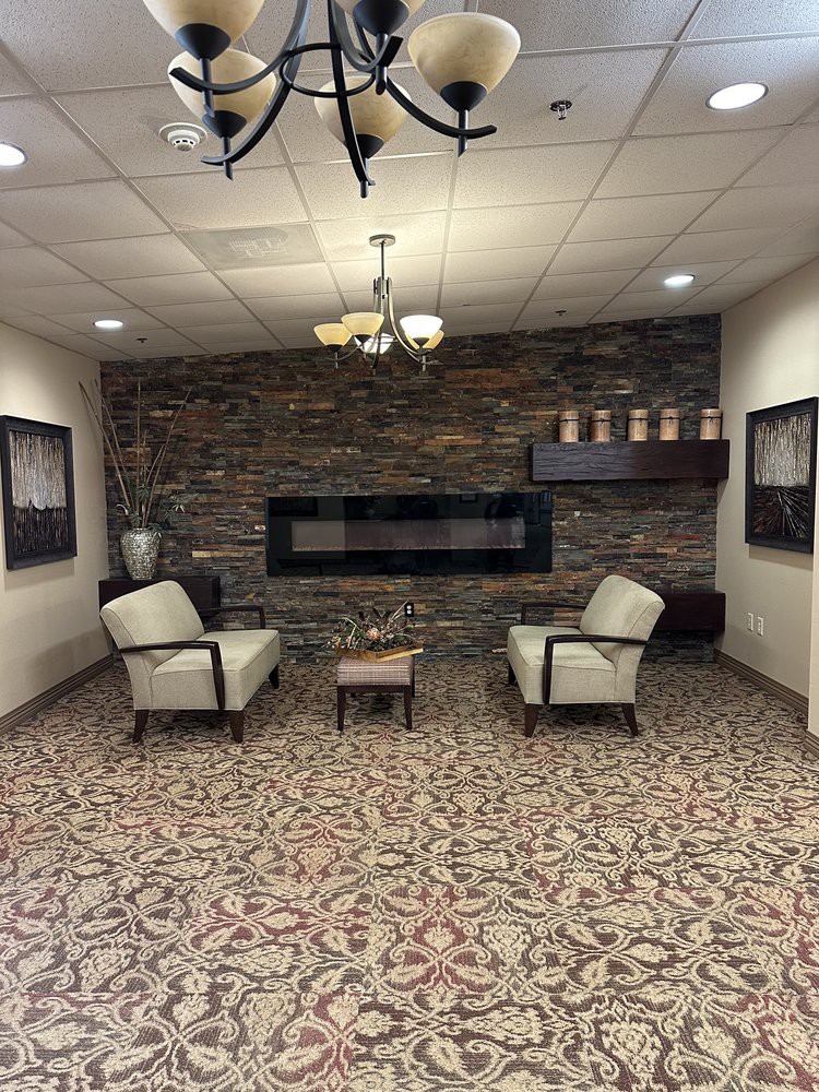 Cozy lobby area with a modern fireplace and elegant seating.