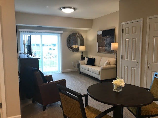 A cozy living room with comfortable seating and modern decor.