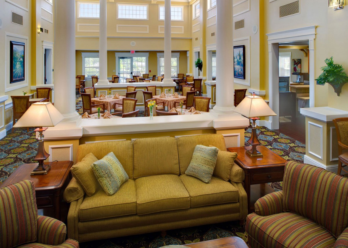 A spacious lounge area with comfortable seating and elegant decor.