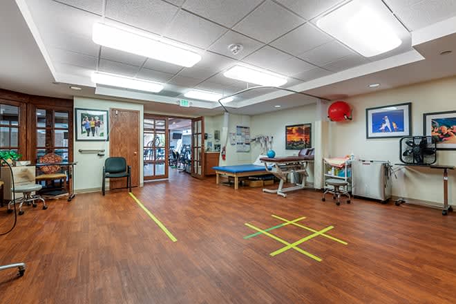 A rehabilitation room equipped for physical therapy exercises.