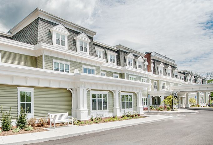 A modern residential building with stylish architecture and multiple windows.
