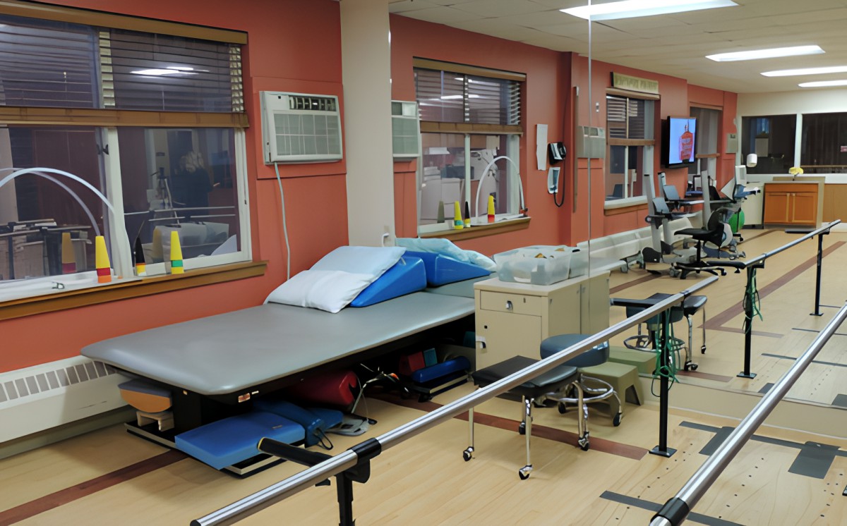 A rehabilitation clinic with physical therapy equipment and exercise areas.