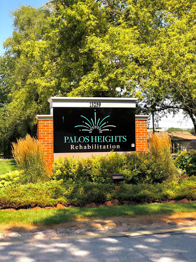 Welcome sign for Palos Heights Rehabilitation, surrounded by lush landscaping.