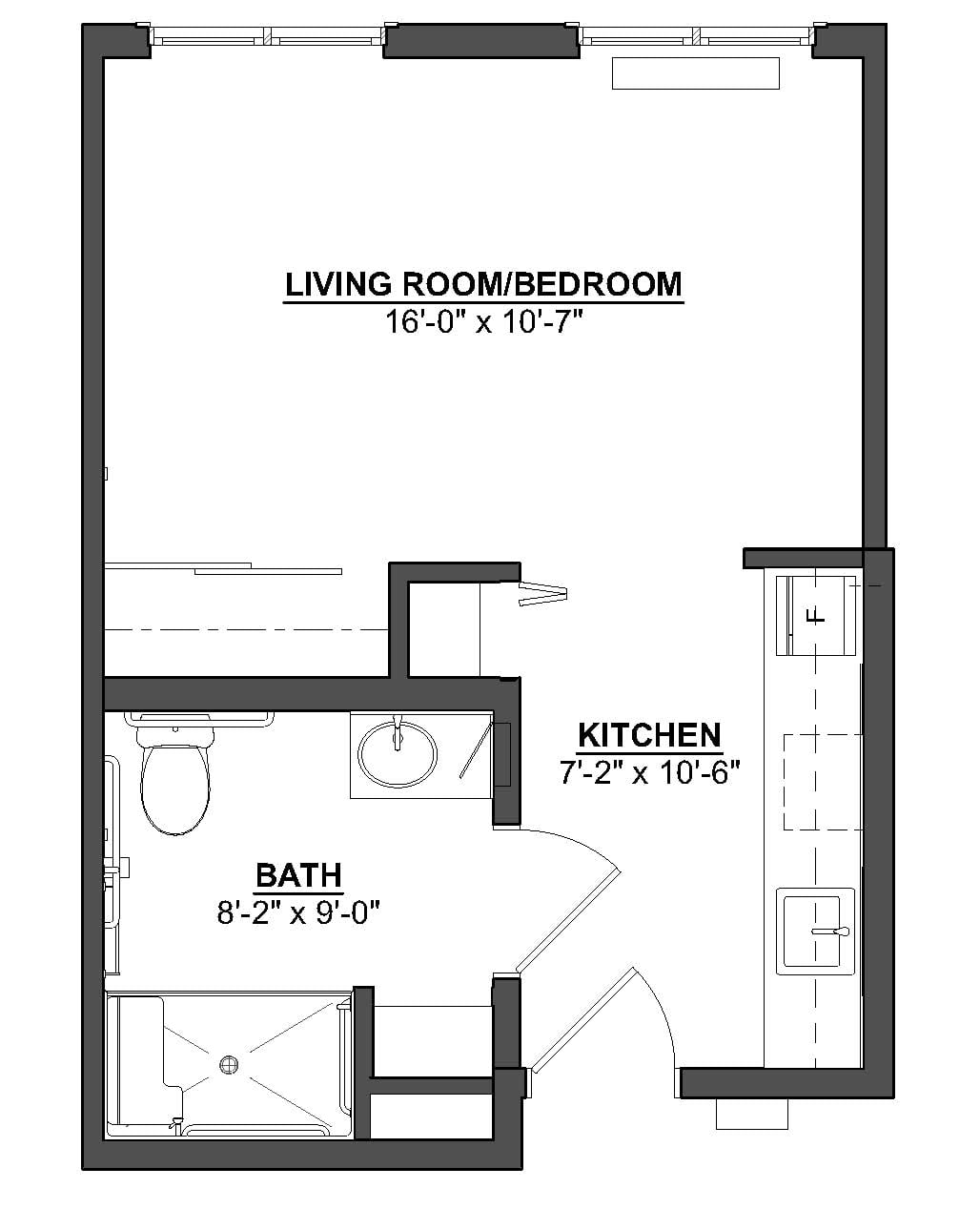 Studio apartment floor plan with designated kitchen and bathroom areas.