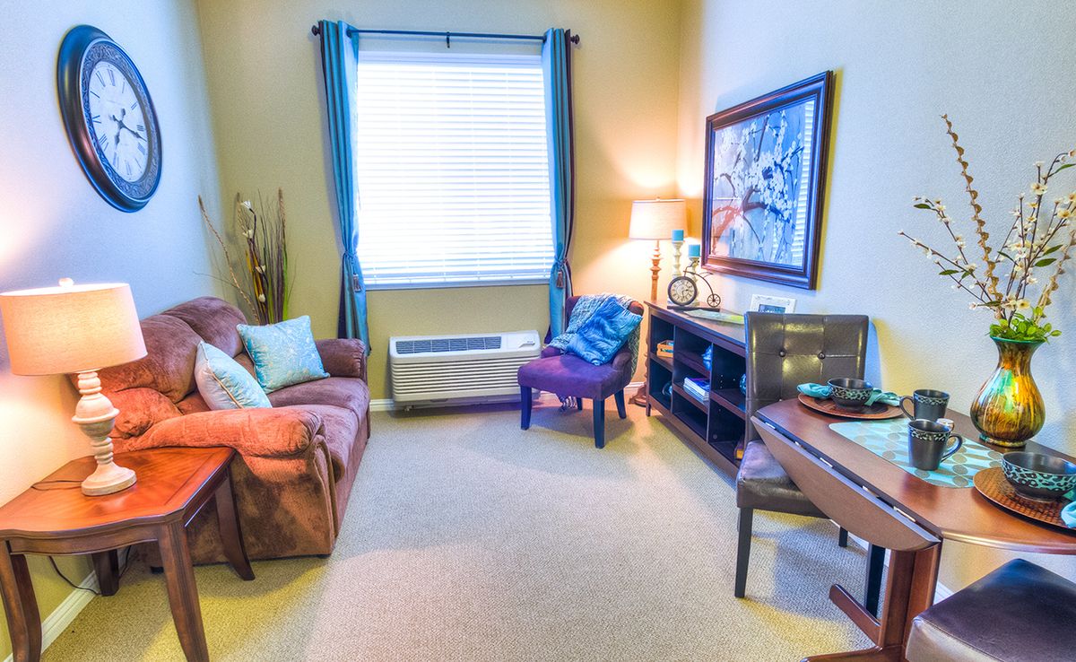 Cozy living room with comfortable seating and warm lighting.