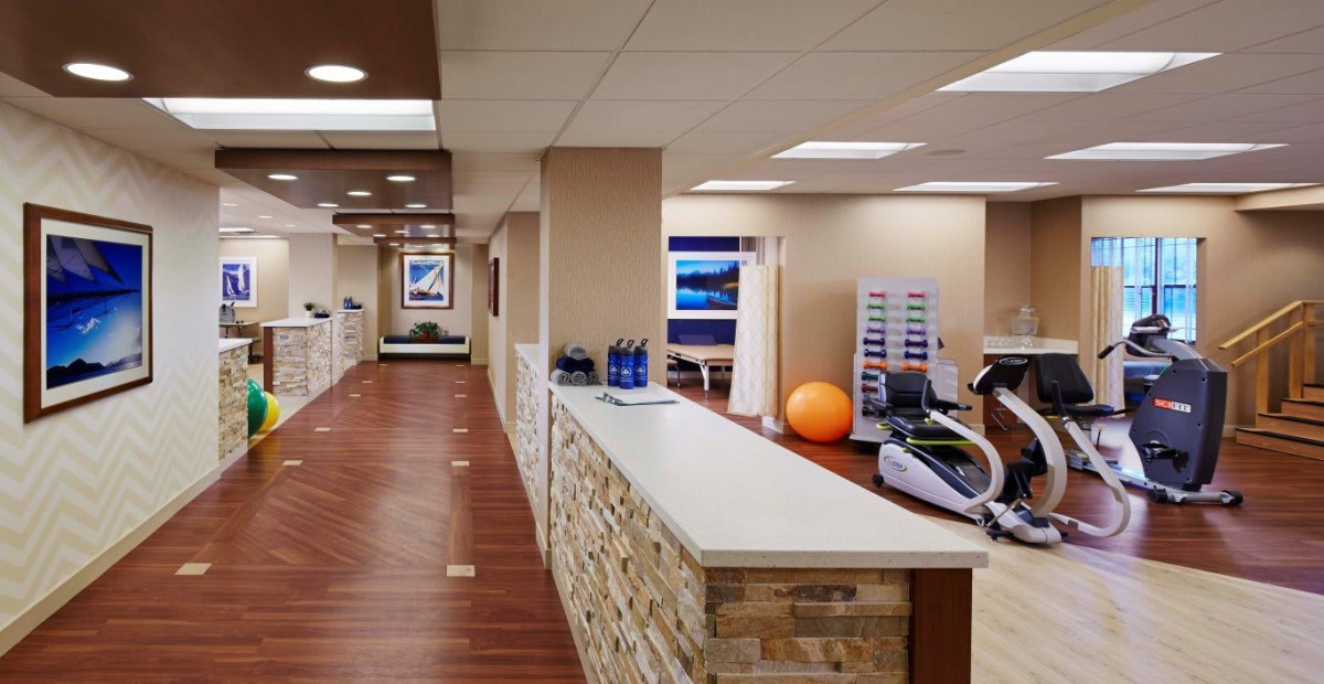 A modern office reception area with fitness equipment and a welcoming design.