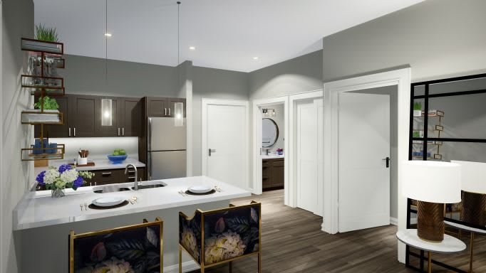 A modern apartment kitchen with a sleek design and a central island.