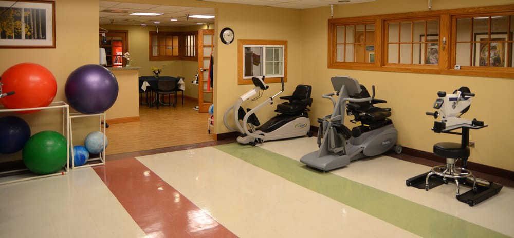 A room featuring exercise equipment, including stationary bikes, likely in a rehabilitation or fitness center.