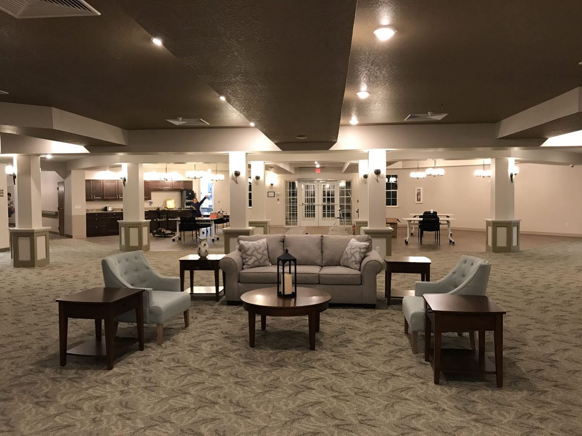 Spacious lobby area with arranged seating and elegant lighting.