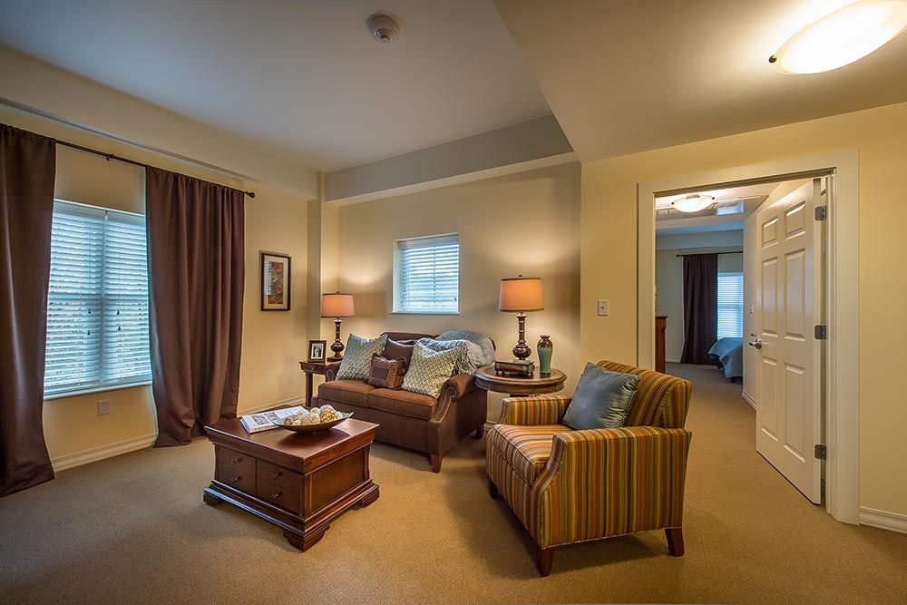 A cozy living room with comfortable seating and warm lighting.