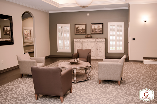 A cozy and elegantly styled living room featuring comfortable seating arrangements and tasteful decor.
