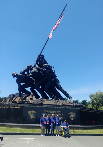 Visitors gathered at the iconic Iwo Jima Memorial, celebrating military history.