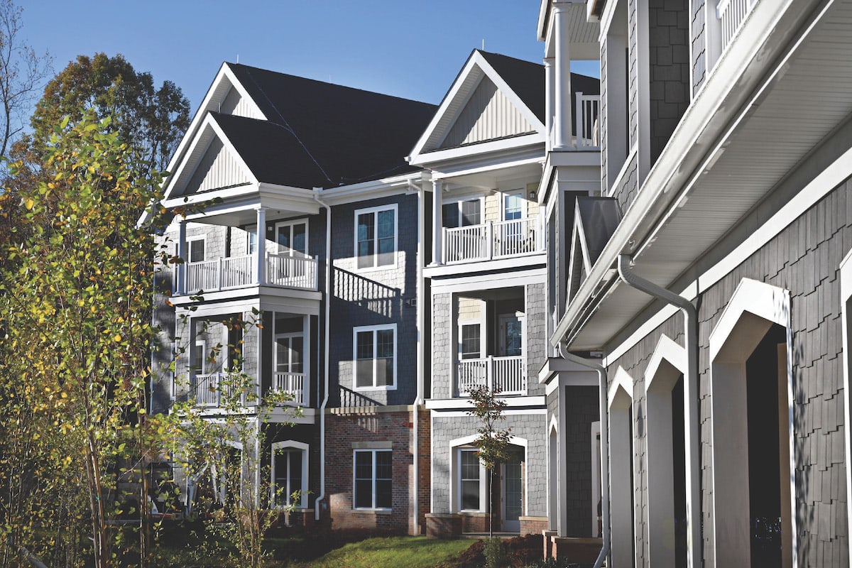 A modern apartment complex with balconies and stylish architecture.