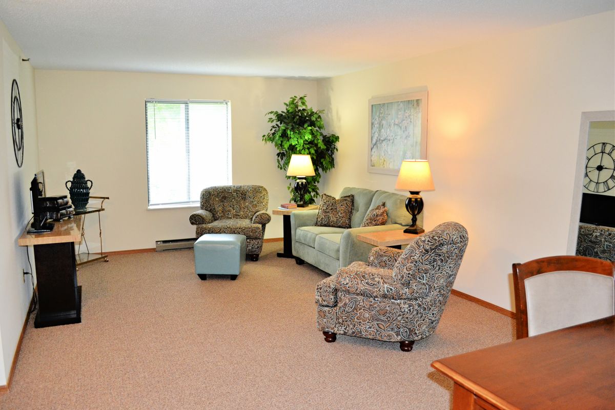 A cozy living room with comfortable seating and warm lighting.