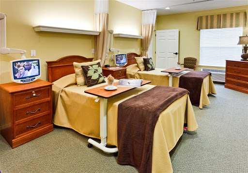 A well-equipped hospital room featuring two patient beds, designed for comfort and convenience.