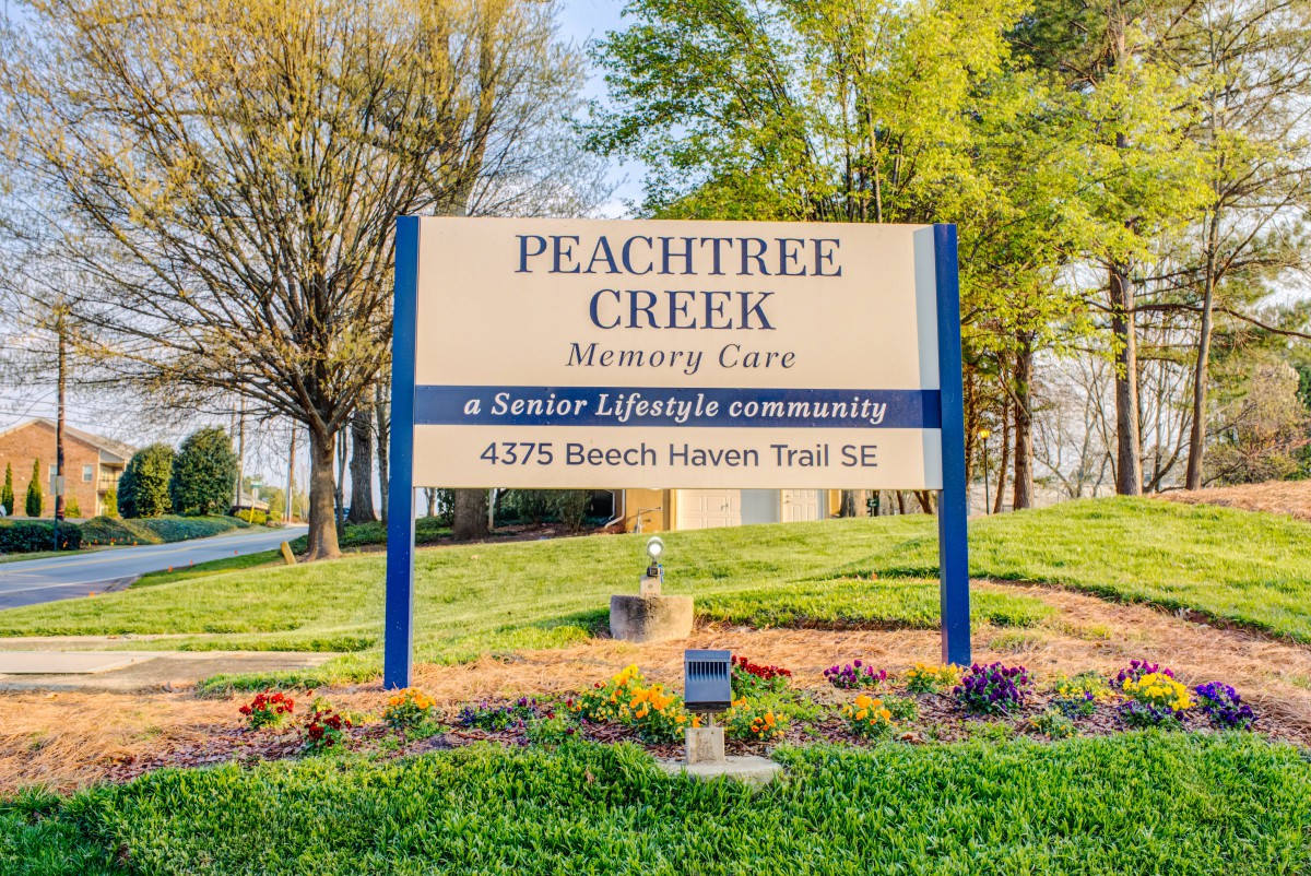 Sign for Peachtree Creek Memory Care, a senior lifestyle community.