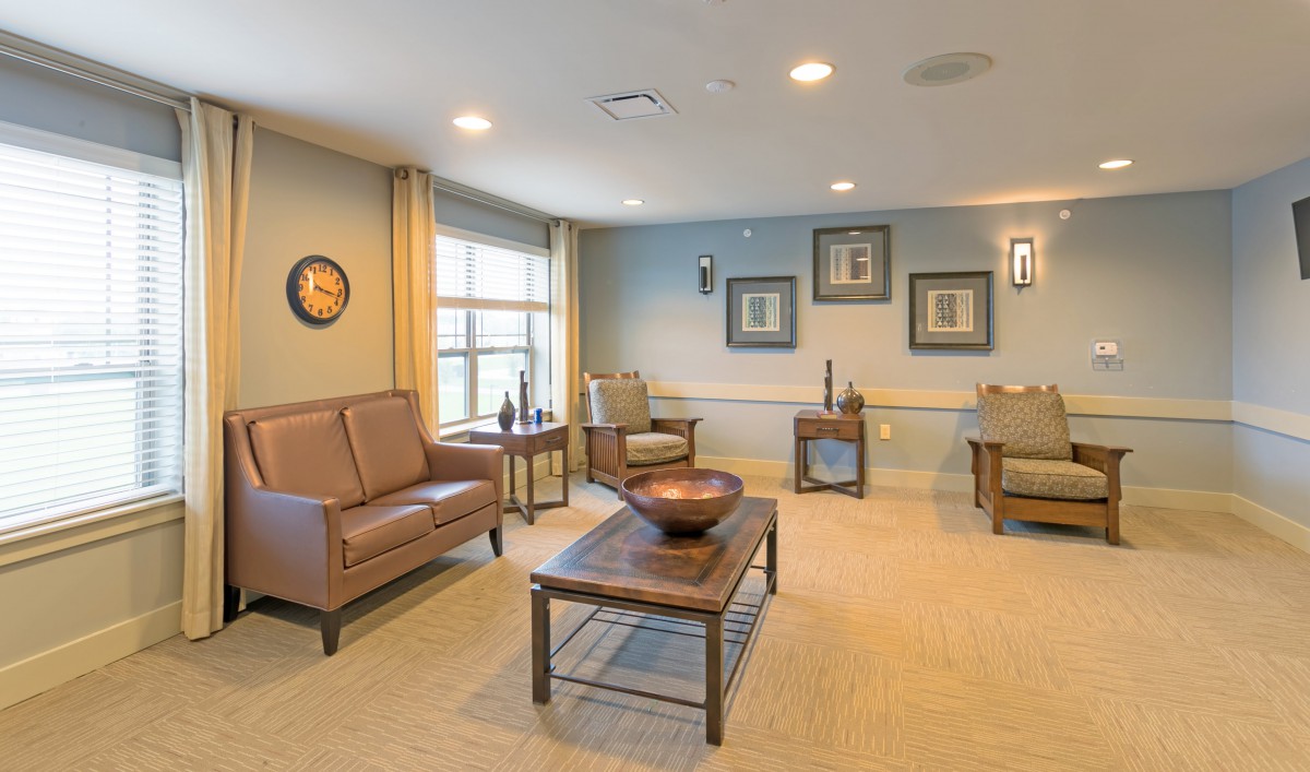 A cozy and well-decorated living room with comfortable seating and tasteful decor.
