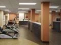 A modern fitness center with treadmills and other exercise equipment.