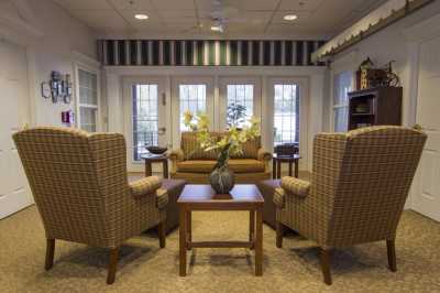 A cozy living room with comfortable seating and elegant decor.