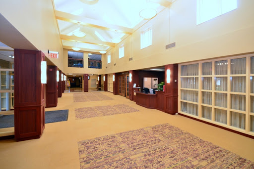 A welcoming hotel lobby with a spacious hallway and modern decor.