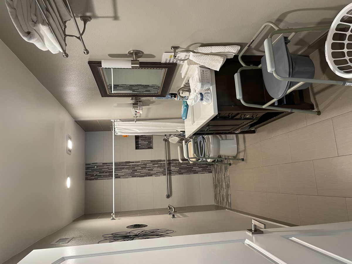An accessible bathroom with a walk-in shower and modern amenities.